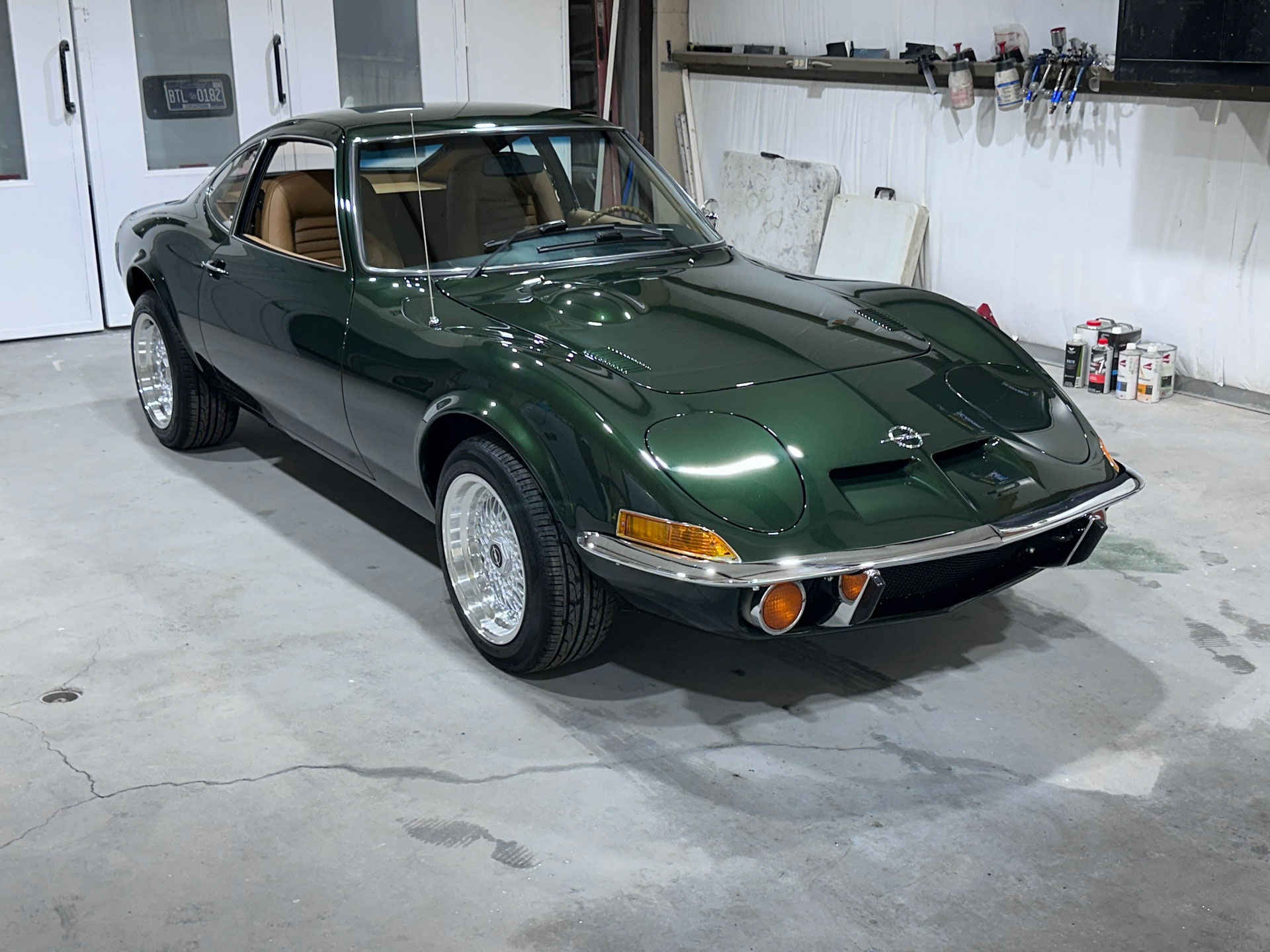 Fully restored 1972 Opel GT with dark green paint and refreshed interior